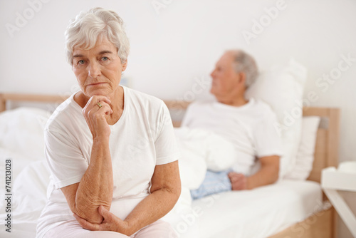 Senior, couple and sad in bedroom with conflict, ignore and crisis in marriage for mental health or retirement. Elderly, woman or man with fight, argument or divorce on bed in home with disagreement © AW/peopleimages.com