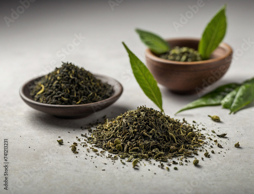 powder green tea and green tea leaf on a white background
