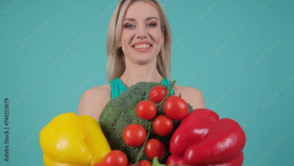 A joyful woman with a plate of veggies, embracing natural foods and a smile. A joyful woman with a plate of veggies, embracing natural foods and a smile.