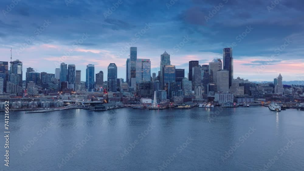 City lights in purple sunset sky Washington. Downtown Seattle at pink sunset. Scenic Seattle skyline panorama. Aerial view downtown at night scene.Beautiful urban landscape of coastal bay city at dusk City lights in purple sunset sky Washington. Downtown Seattle at pink sunset. Scenic Seattle skyline panorama. Aerial view downtown at night scene.Beautiful urban landscape of coastal bay city at dusk