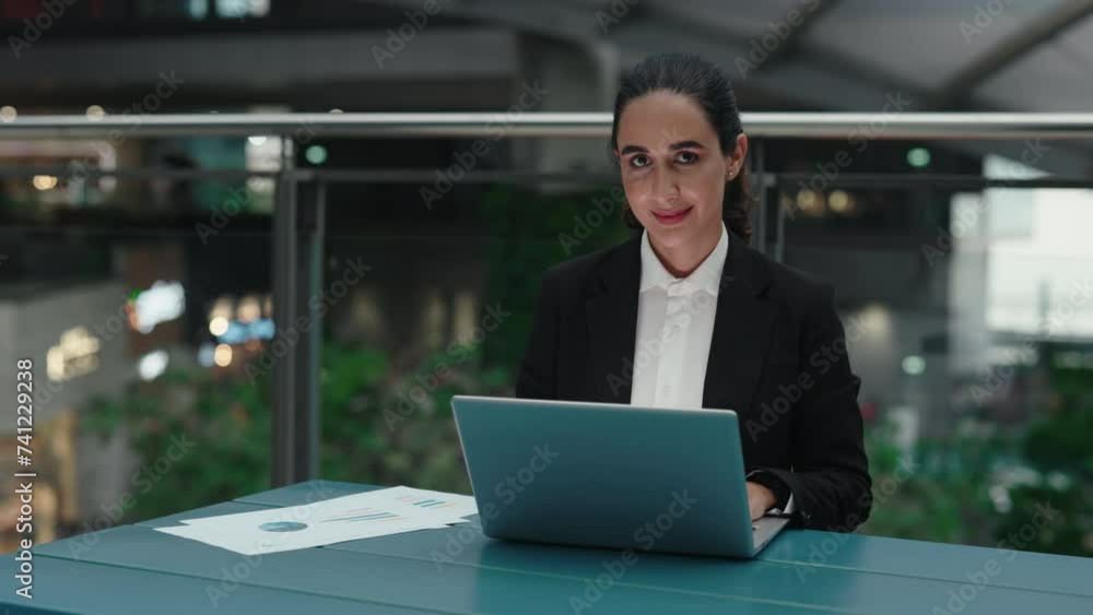 Portrait of a Charming Successful Woman Working on a Laptop in a New Office Portrait of a Charming Successful Woman Working on a Laptop in a New Office