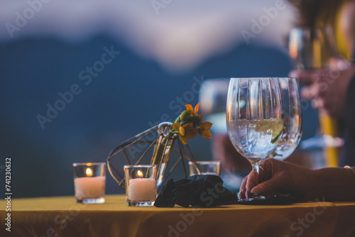 Wine glasses by candlelight in the evening