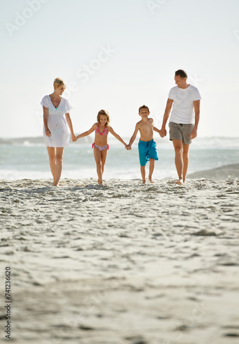 Parents, children and beach on vacation in summer with holding hands and smile for happiness in Florida. Family, adventure and travel for holiday with kids to relax, fun and enjoy trip in seaside.