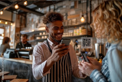 Happy beautiful waiter having fun while talking to his guests scan QR code with smartphone in a coffee shop