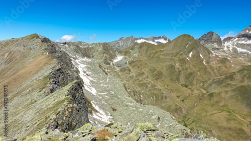 Panoramic view of unique mountain ridge Boese Nase in Ankogel Group, Carinthia, Austria. Idyllic hiking trail in remote Austrian Alps in summer. Looking at majestic rugged terrain of alpine landscape photo