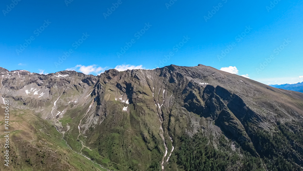 Panoramic view of unique mountain ridge Boese Nase in Ankogel Group, Carinthia, Austria. Idyllic hiking trail in remote Austrian Alps in summer. Looking at majestic rugged terrain of alpine landscape