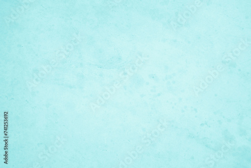 Pastel blue and white concrete stone texture for background in summer wallpaper. Cement and sand wall of tone vintage. Decorative abstract wall of light cyan color painted, Beautiful mint green decor.