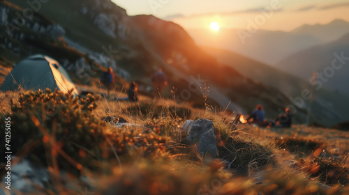 Camping and tent in nature park with sunrise behind the mountain.