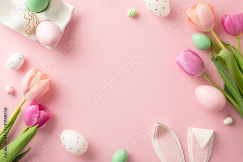 Spring Celebration Theme: top view vibrant eggs holder, adorable bunny ears, blooming tulips create festive scene on soft pastel background. Perfect for Easter greetings with frame for your text or ad