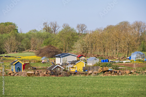 Idyllic allotment garden with sheds in the countryside