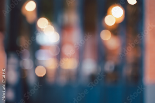 Abstract blurred image of cafe or restaurant with bokeh lights background at night. photo