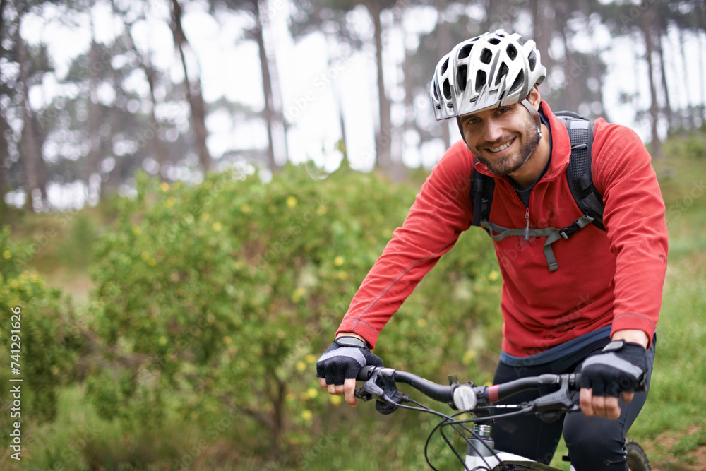 Portrait, fitness and man cycling in countryside for adventure, discovery or off road sports hobby. Exercise, smile and health with young cyclist on bike in nature for cardio training or workout Portrait, fitness and man cycling in countryside for adventure, discovery or off road sports hobby. Exercise, smile and health with young cyclist on bike in nature for cardio training or workout