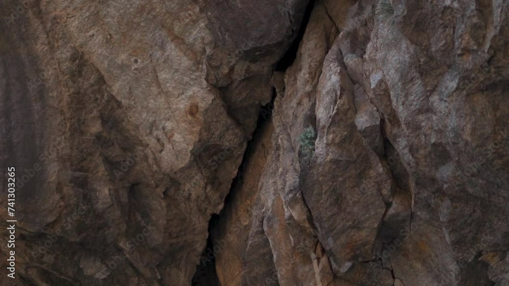Close-up shot of cracks on the rocky mountains at Kinnaur in Himachal Pradesh, India. Rocky mountain with crack on it due to landslide. Risky travel in the mountains due to crack after rain. Close-up shot of cracks on the rocky mountains at Kinnaur in Himachal Pradesh, India. Rocky mountain with crack on it due to landslide. Risky travel in the mountains due to crack after rain.