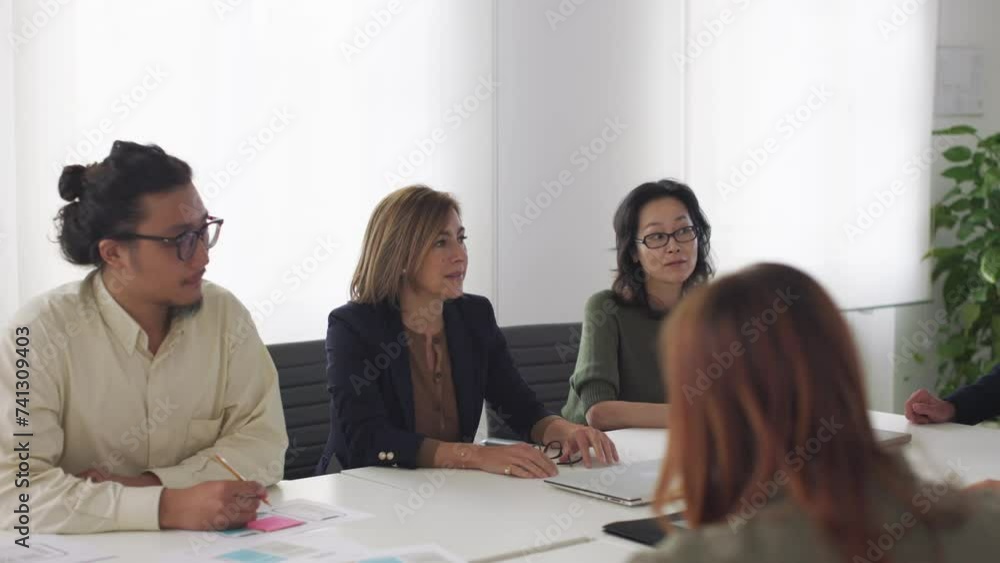 seniors and junior management - businesspeople during a meeting - company leaders sitting at boardroom table seniors and junior management - businesspeople during a meeting - company leaders sitting at boardroom table