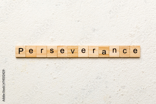 perseverance word written on wood block. perseverance text on table, concept photo