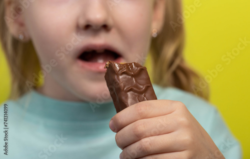 A seven year old little caucasian girl s dirty mouth from eating a candy bar. Diabetes mellitus and glucose. Caries