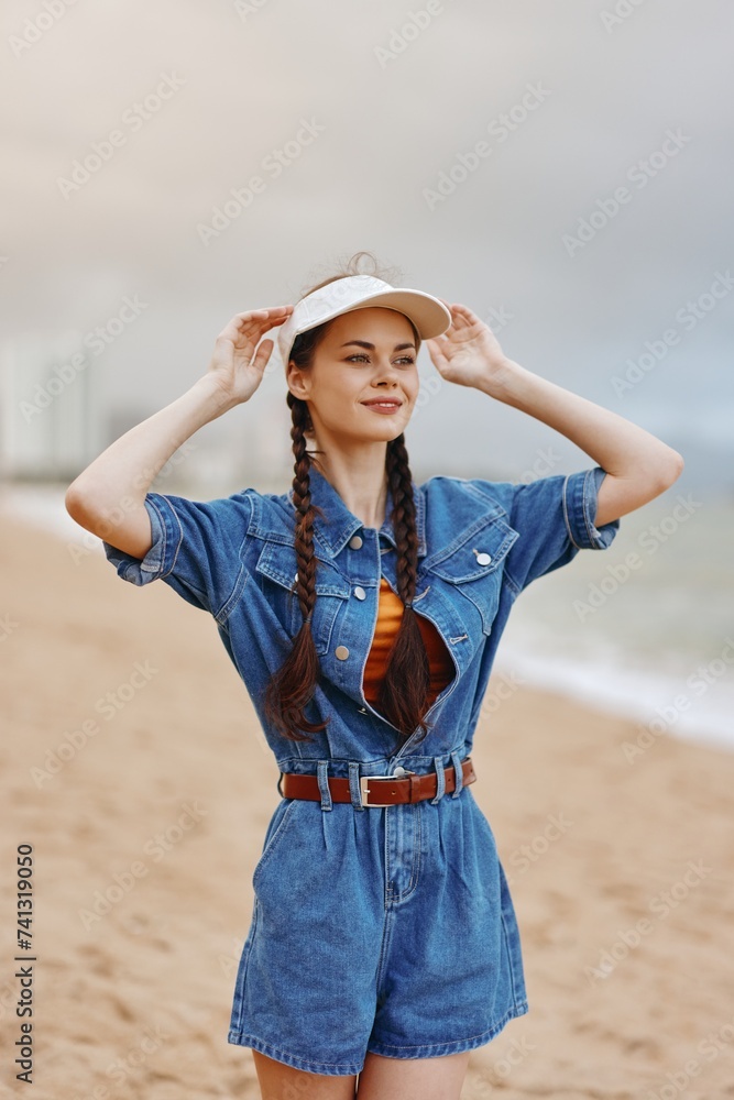 Beauty in Nature's Hat: Attractive Young Woman Relaxing by the Sunny Sea, Fashionably Modelled in a Pretty Dress against a Tropical Beach Background Beauty in Nature's Hat: Attractive Young Woman Relaxing by the Sunny Sea, Fashionably Modelled in a Pretty Dress against a Tropical Beach Background