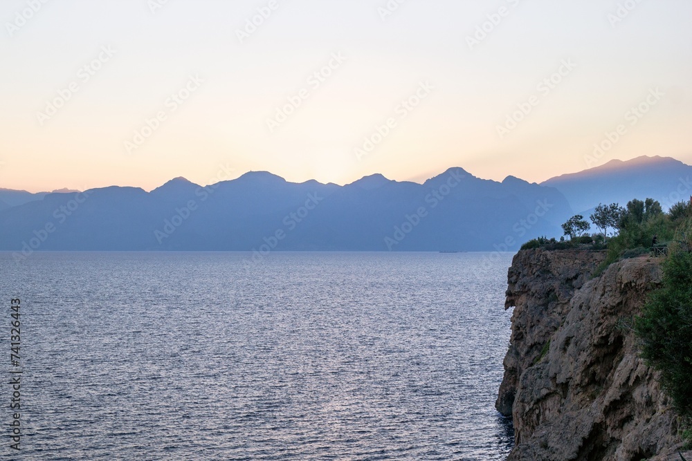 Picturesque mountain range juts into the tranquil blue lake below