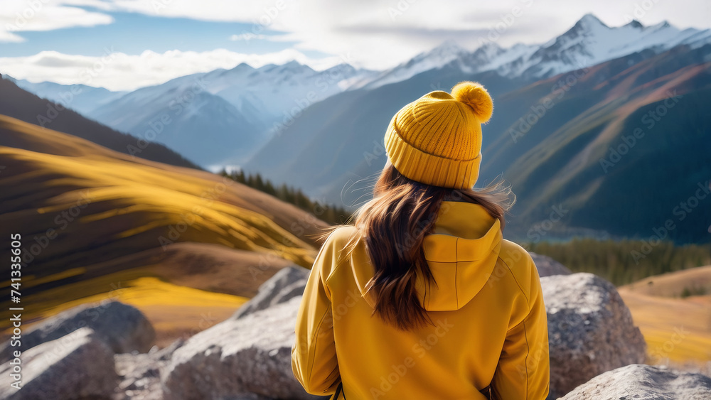 Tranquil Young Woman Explorer in Mustard-Colored Beanie Delighting in the Peaceful Mountain Vista. Embracing Mindfulness and Nature's Thrilling Escapade.