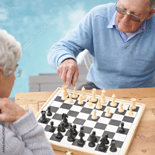 Senior, couple and game of chess outdoor together in retirement with competition of strategy. Thinking, challenge and elderly man and woman with activity or contest on board for holiday or vacation