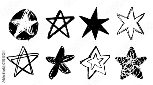 Set of black doodle style stars drawn by hand. Grunge scrawls, charcoal scribbles, rough brush strokes, underlines. Bold charcoal freehand stars. Crayon or marker scribbles photo