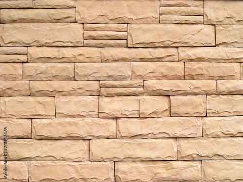 row of stack beige sandstone brick block textured, building exterior facade decor