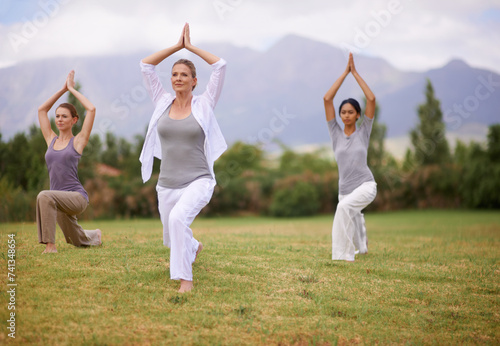 Woman, personal trainer and yoga on field for spiritual wellness, namaste or wellbeing in nature. Female person or fitness teacher for zen, balance or stretching in outdoor exercise on green grass