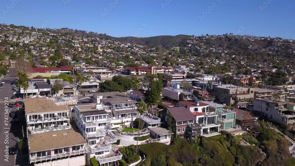 4K Panning Drone Shot of Beach and Homes in Laguna Beach, California on a Warm Sunny Day over the Pacific Ocean 4K Panning Drone Shot of Beach and Homes in Laguna Beach, California on a Warm Sunny Day over the Pacific Ocean