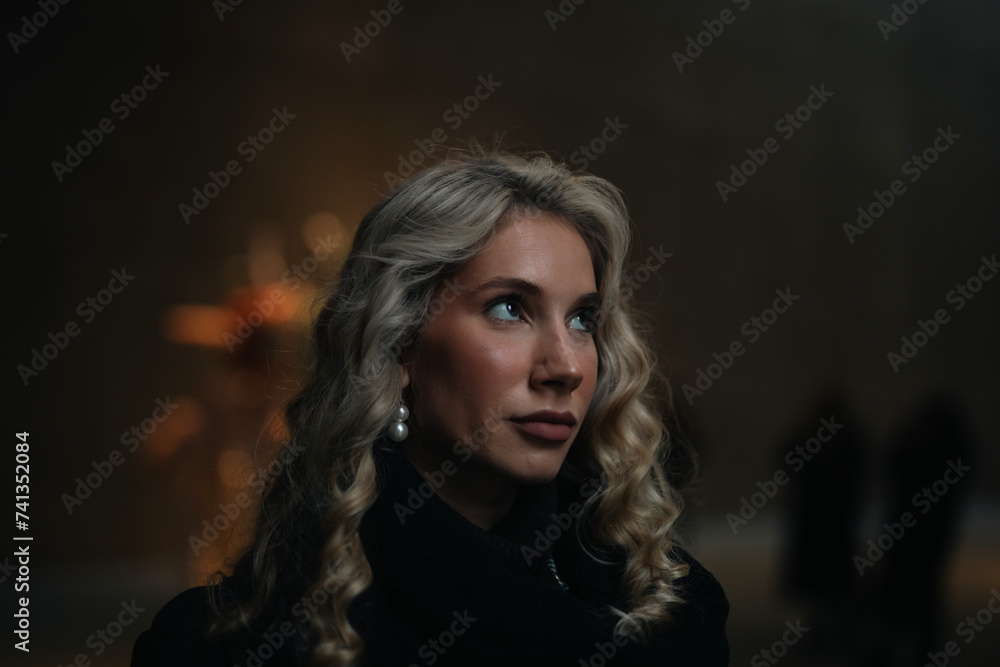 Elegant rich independent Woman in Black Dress with make up in an fancy restaurant and bar over the top berlin