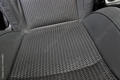 The backrest of the driver's seat in a car with different trim materials 