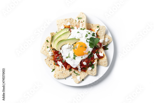 Traditional Mexican breakfast red chilaquiles with egg isolated on white background. Top view