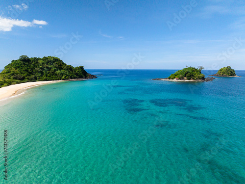 Nacpan Beach and Islets with clear turquoise sea water. El Nido, Philippines.