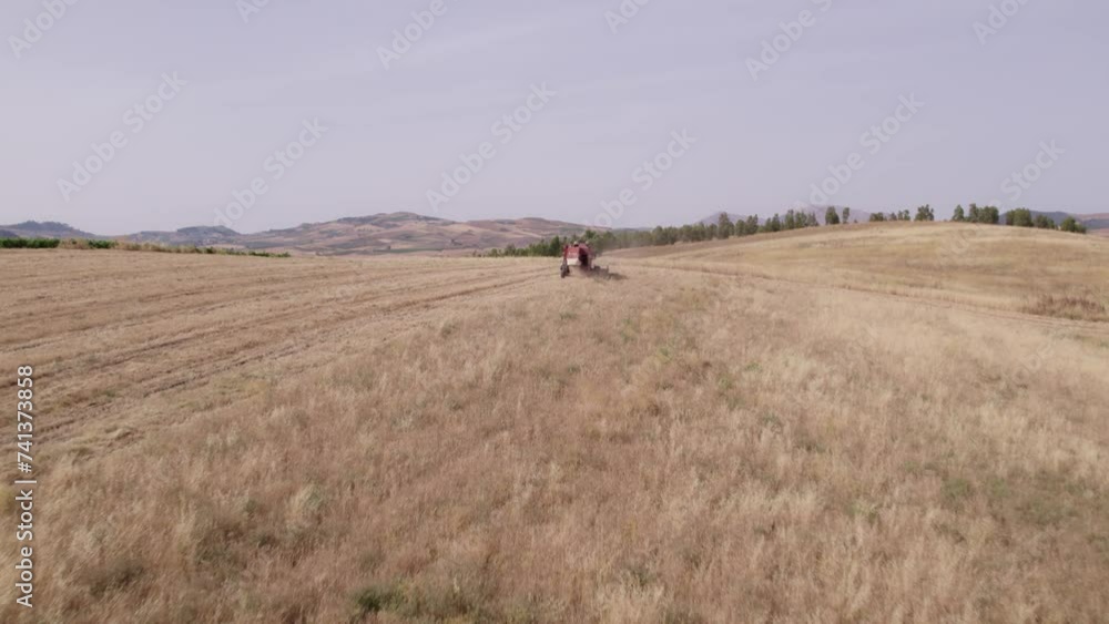 Aerial view of Chickpea harvesting with a Combine harvester, Sicily, Italy. Aerial view of Chickpea harvesting with a Combine harvester, Sicily, Italy.