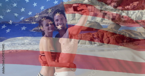 Image of flag of usa over caucasian couple on beach in summer