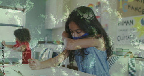Image of coronavirus cells and schoolgirl in wearing face mask and coughing