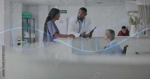 Image of dna strand and data processing over diverse doctors in hospital