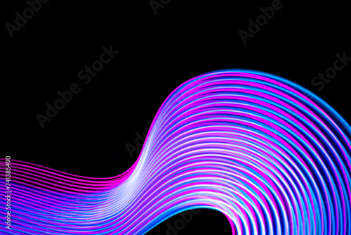 Abstract neon modern pink and blue waves curvy lines on black background. Technology data. High quality photo