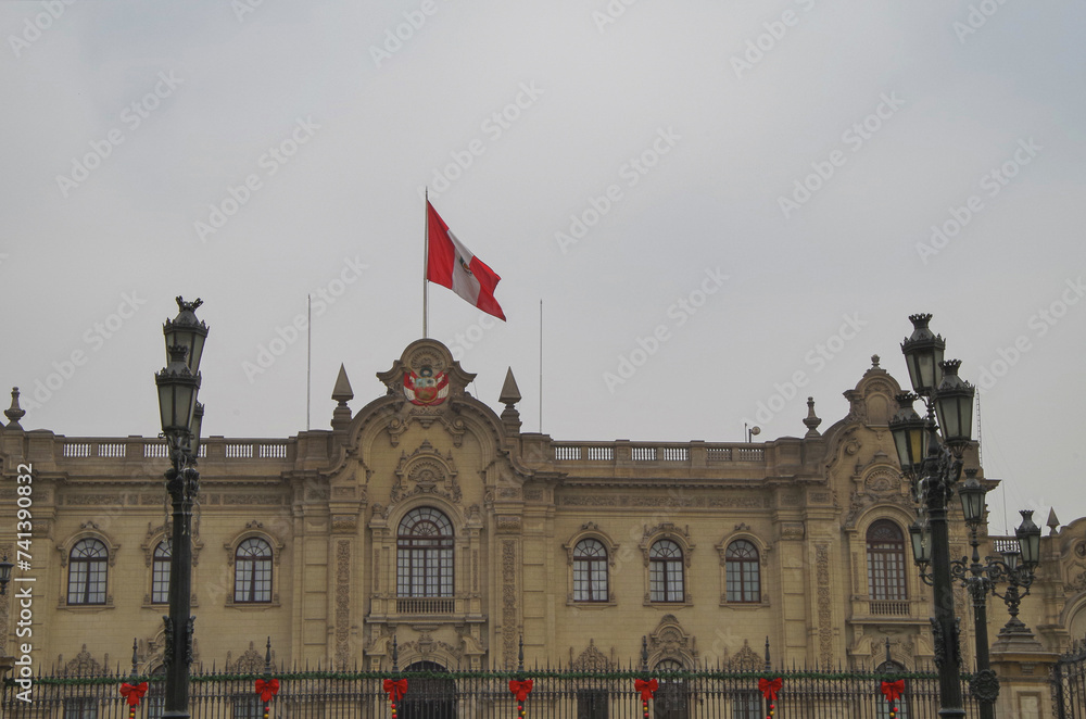 Obraz premium Colonial Latin American architecture downtown house building facades with busy traffic street, police and people tourists in old town Lima, Peru with every day big city life scenery