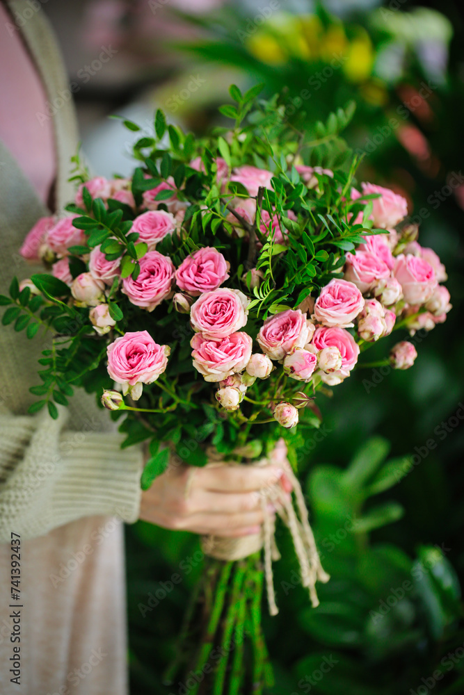 Woman Holding Bouquet of Pink Roses