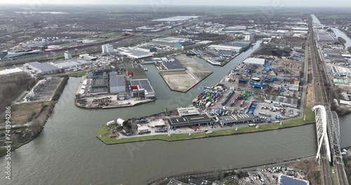 The inland shipping port of Utrecht, industrial zone along the water. Logistics, production industry. The Netherlands, Aerial birds eye view. photo