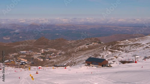 chairlifts in operation at a snowy ski resort