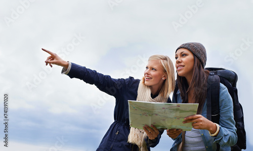Cuadro en lienzo Woman, friends and pointing with map for direction or location on hiking adventure together in nature