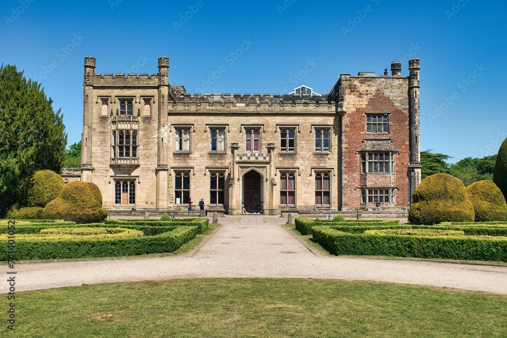 Elvaston, Derby, Derbyshire, England, UK. June 20, 2020 Front view of Elvaston Castle on a sunny day with surrounding green parkland and blue sky. This was during the Covid 19 Pandemic.