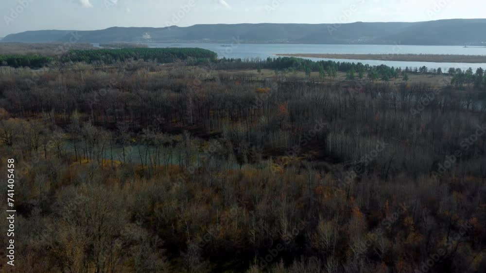 Autumn Overlook Aerial Views of Volga River, Forest, and the Grushinsky Festival Meadow in Warm Glow. Nature of Russia view from a drone in autumn Autumn Overlook Aerial Views of Volga River, Forest, and the Grushinsky Festival Meadow in Warm Glow. Nature of Russia view from a drone in autumn