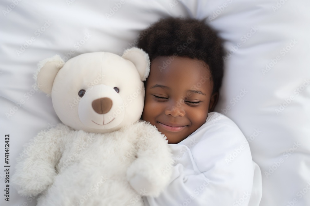 a darkskinned boy sleeps sweetly in bed with a toy bear in his arms under the blanket a darkskinned boy sleeps sweetly in bed with a toy bear in his arms under the blanket