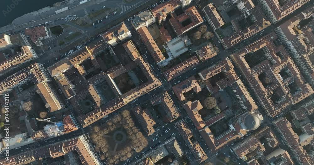 Aerial top down view of rooftops in Turin downtown along the Po river at sunset, Turin, Piedmont, Italy. Aerial top down view of rooftops in Turin downtown along the Po river at sunset, Turin, Piedmont, Italy.