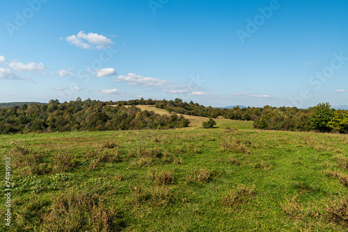 Eolling landscape with smaller hills covered by mix of meadows and forests - Silicka planina in Slovensky kras in Slovakia