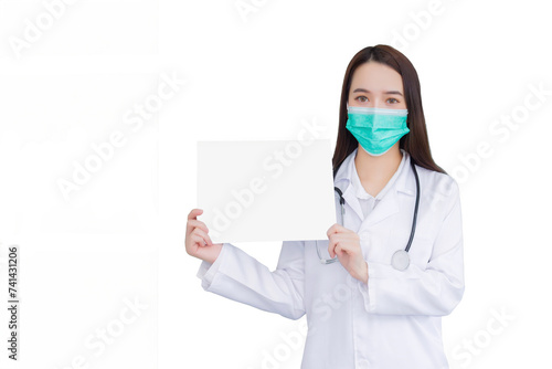 Young professional Asian woman doctor who wears white medical coat and face mask stands and shows white paper in hospital while isolated white background.
