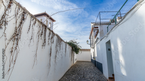 Street in the popular neighborhood of Albaicin in the city of Granada, in Andalusia, Spain photo