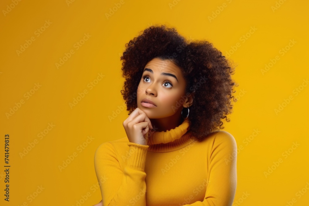 A woman wearing a yellow turtle neck sweater. Suitable for fashion or lifestyle concepts A woman wearing a yellow turtle neck sweater. Suitable for fashion or lifestyle concepts